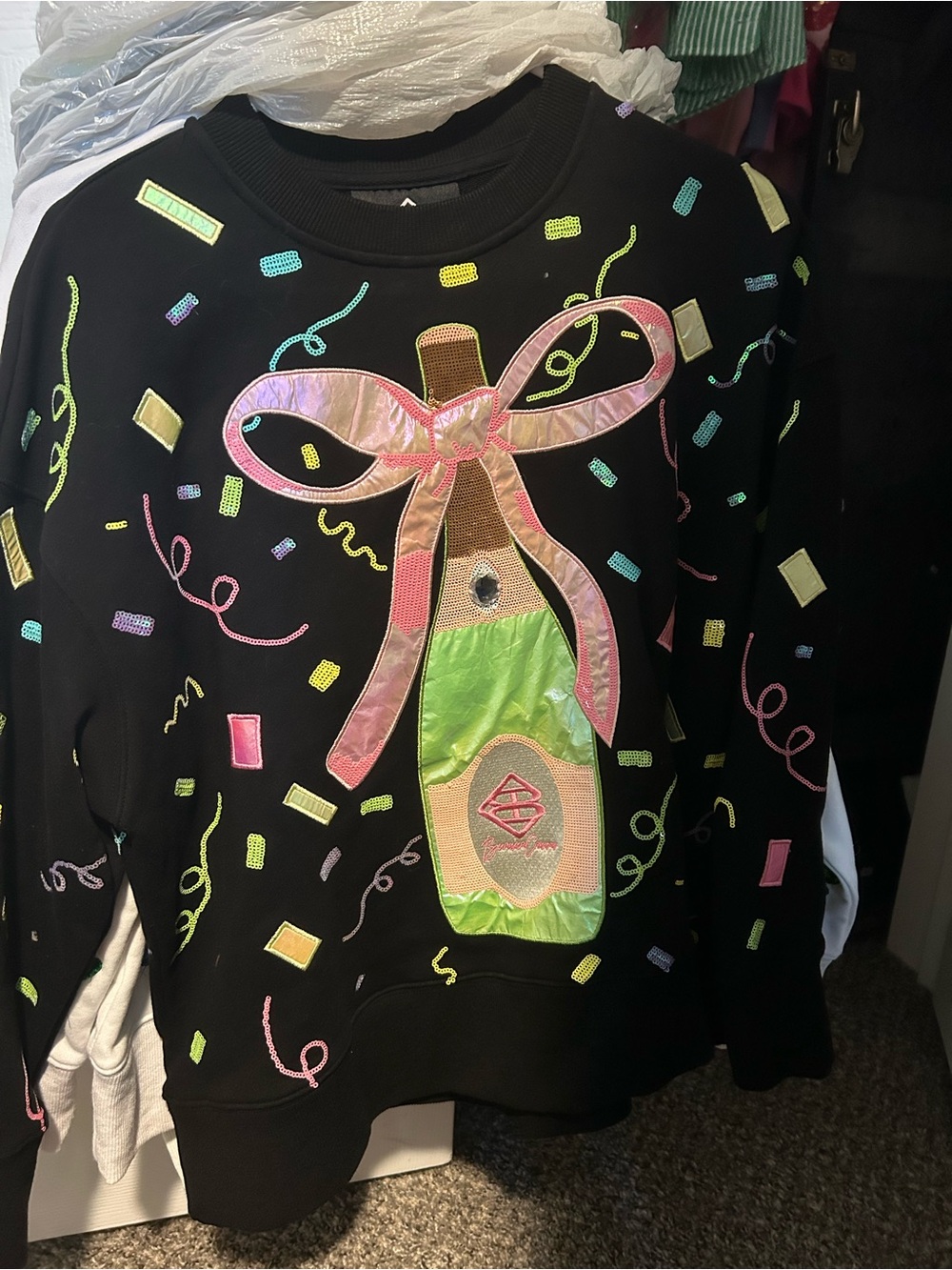 Black Sweatshirt with Festive Champagne Bottle Applique - Unbranded